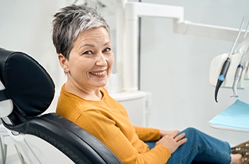 Happy senior dental patient looking over her shoulder?