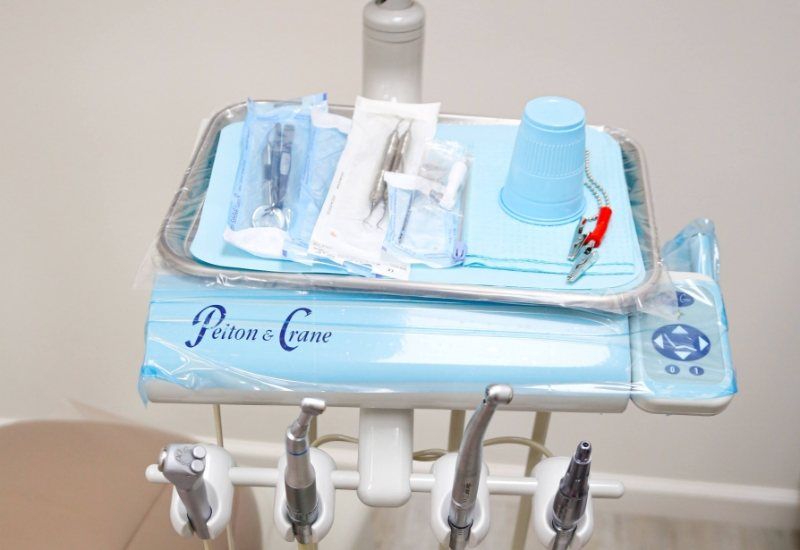 Dental instruments on tray in dental exam room