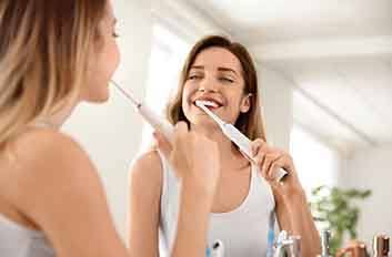 Woman brushing her teeth