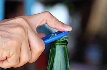 Man using a bottle opener