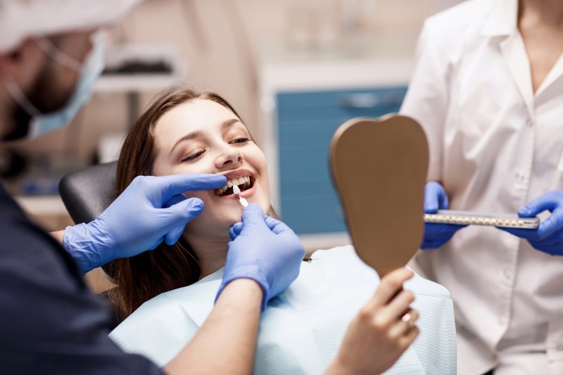 a woman preparing to receive cosmetic dentistry  